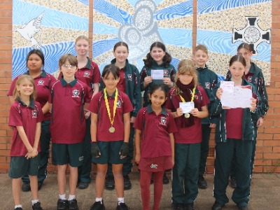 Students posing for a group photo with their awards from Kingaroy Eisteddfod